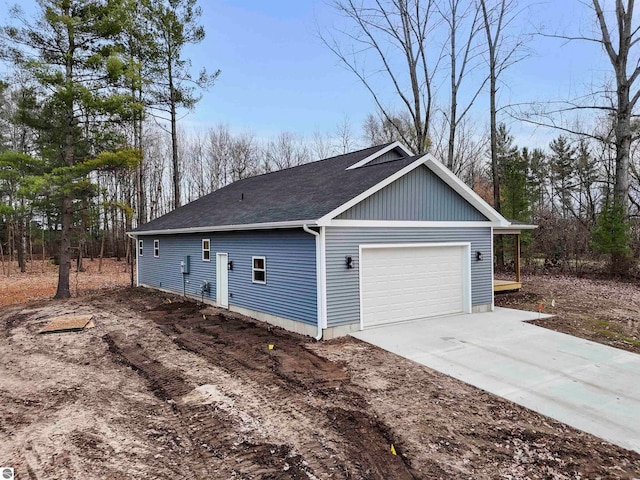 view of side of home featuring a garage