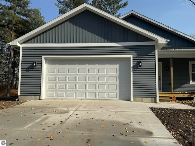 view of front of property with a porch and a garage