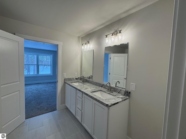 bathroom with tile patterned flooring and vanity