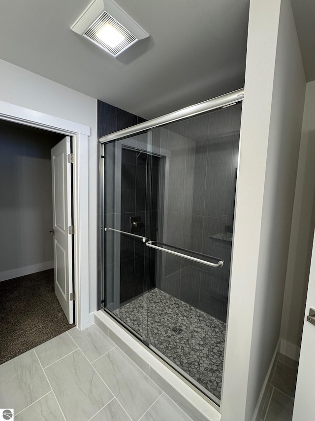 bathroom featuring an enclosed shower