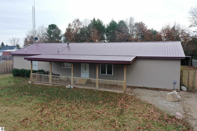 rear view of house with a lawn