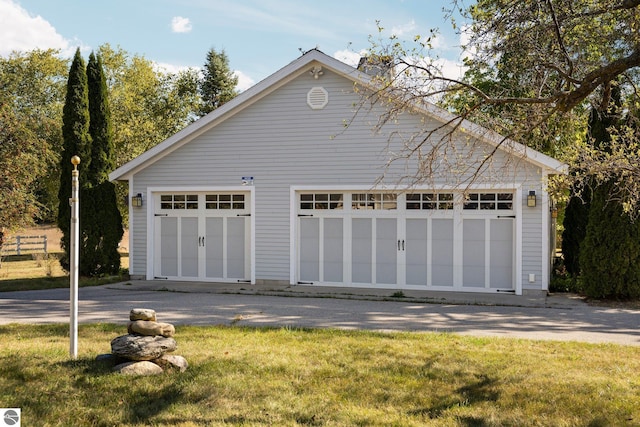 garage with a lawn