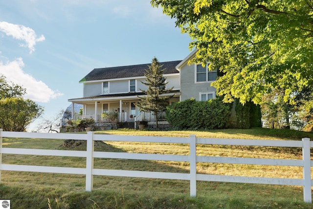 view of front of house with a front lawn and covered porch