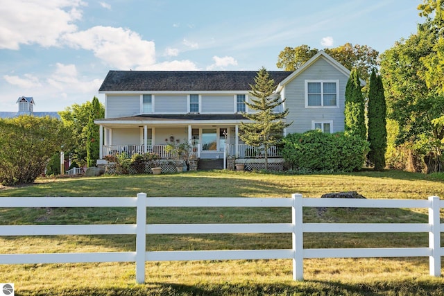 view of front of house featuring a front lawn and covered porch