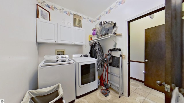 laundry area featuring cabinets and independent washer and dryer