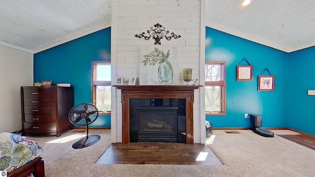 living area featuring carpet flooring, plenty of natural light, and lofted ceiling