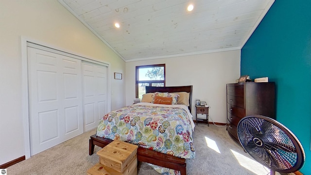 bedroom with light carpet, a closet, wood ceiling, and vaulted ceiling