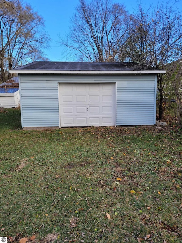 garage with a yard