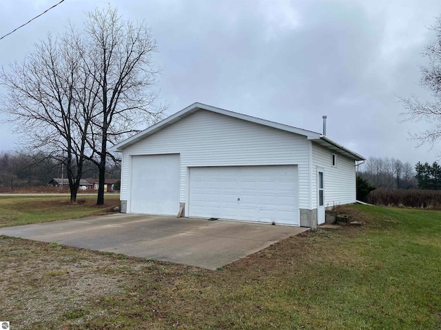 garage with a yard