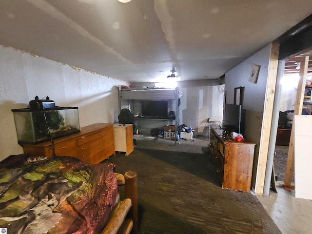 bedroom featuring concrete floors