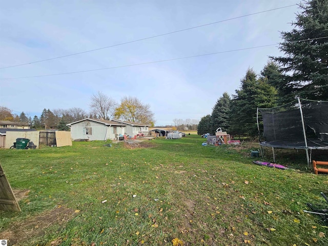 view of yard with a trampoline