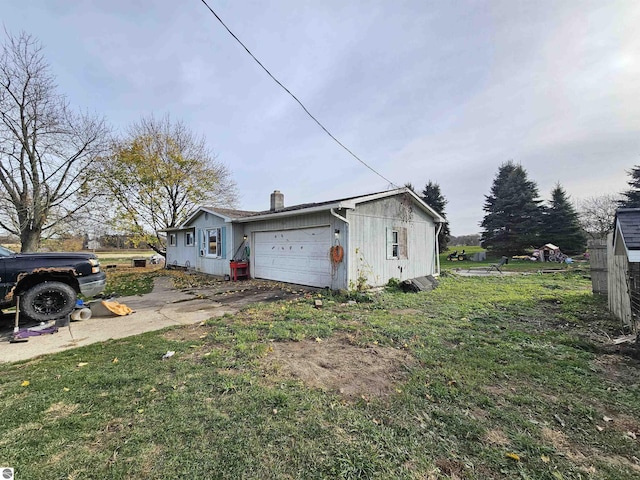 9100 E Miller Rd, Durand, MI 48429 - view of property exterior featuring a chimney and a yard