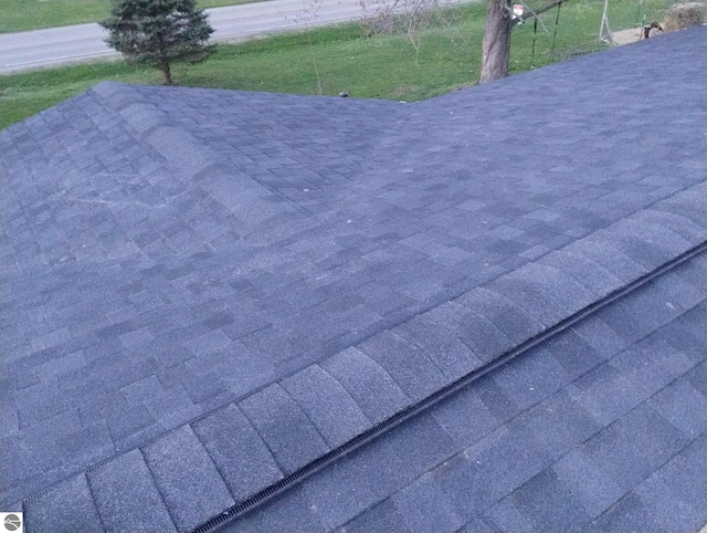 details featuring a shingled roof