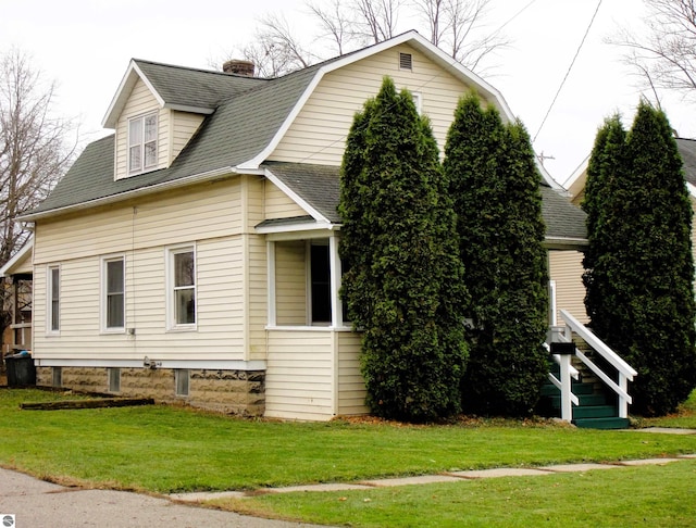 view of home's exterior featuring a lawn