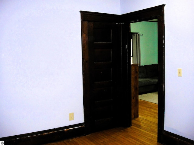 empty room featuring dark wood-type flooring