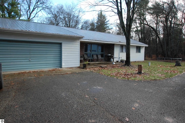 ranch-style home featuring a garage