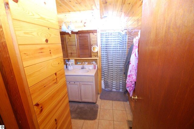 bathroom with tile patterned floors, vanity, wooden ceiling, and a shower with shower curtain