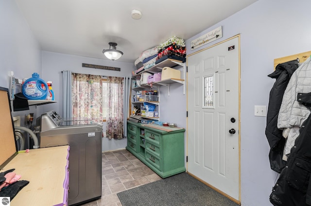 laundry room with washing machine and clothes dryer