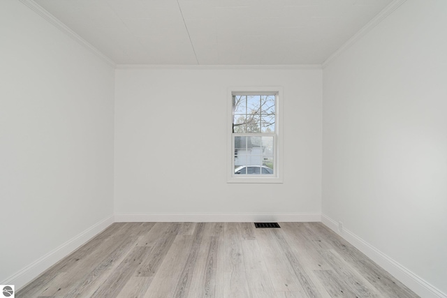 726 Pennsylvania Ave, Alma, MI 48801 - unfurnished room with light hardwood / wood-style flooring and ornamental molding