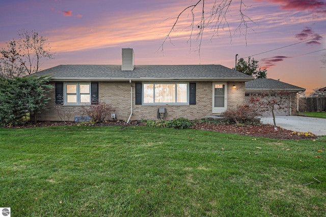 ranch-style house with a yard