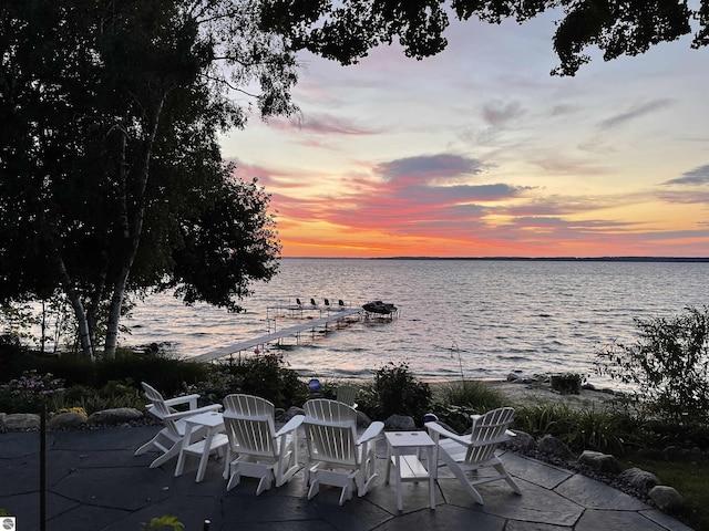 91 S Nanagosa Trl, Suttons Bay, MI 49682 - view of patio with a water view
