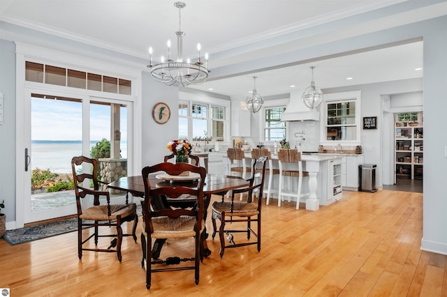 91 S Nanagosa Trl, Suttons Bay, MI 49682 - dining space featuring a chandelier, light wood-style flooring, crown molding, and recessed lighting