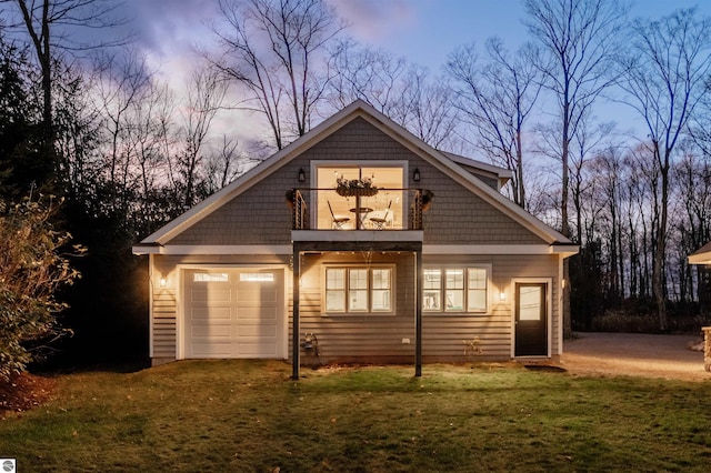 91 S Nanagosa Trl, Suttons Bay, MI 49682 - view of front facade with a balcony, a front lawn, and an attached garage