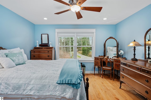 bedroom with ceiling fan and light wood-type flooring