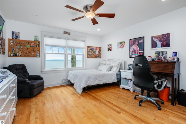 bedroom featuring ceiling fan and light hardwood / wood-style floors