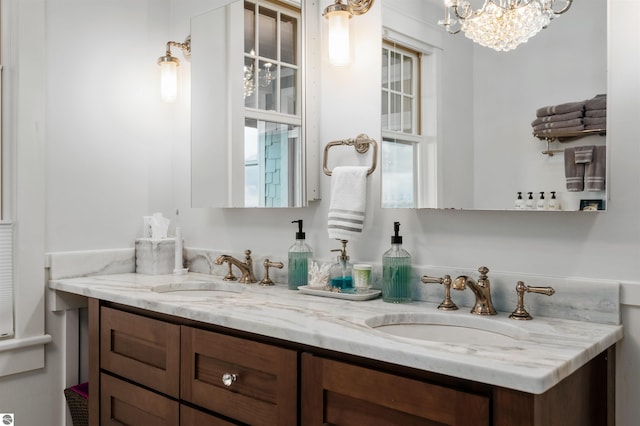 91 S Nanagosa Trl, Suttons Bay, MI 49682 - bathroom with double vanity and a chandelier