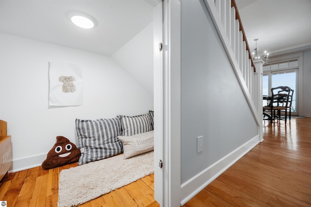 interior space featuring hardwood / wood-style floors and a notable chandelier