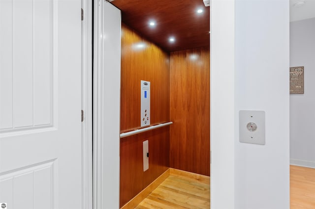 room details featuring wood-type flooring and elevator