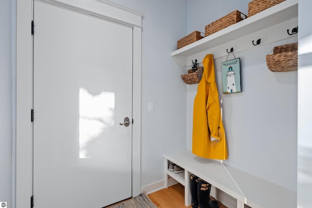 mudroom with light hardwood / wood-style floors