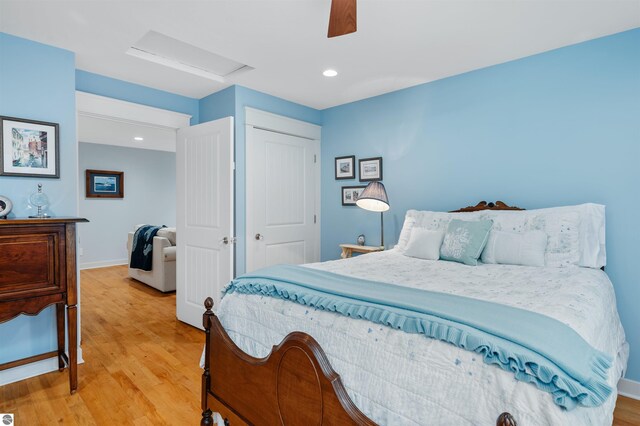 91 S Nanagosa Trl, Suttons Bay, MI 49682 - bedroom featuring attic access, light wood-style floors, ceiling fan, baseboards, and recessed lighting
