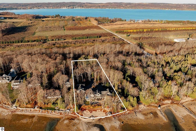 birds eye view of property with a rural view and a water view