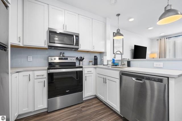 kitchen with white cabinetry, sink, and stainless steel appliances