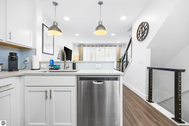 kitchen featuring dishwasher, white cabinets, and sink