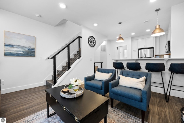 living room featuring dark wood-type flooring