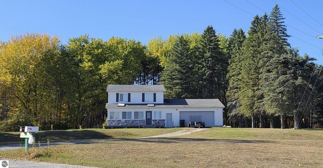 view of front of home with a front lawn