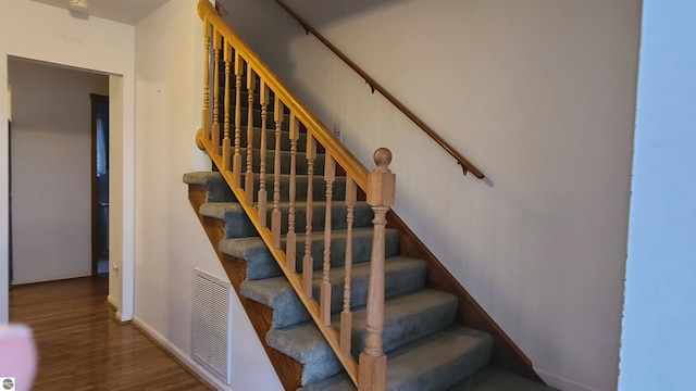 stairway with wood-type flooring