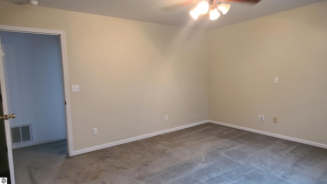 carpeted empty room featuring ceiling fan