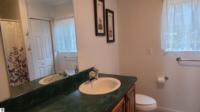 bathroom with vanity and toilet