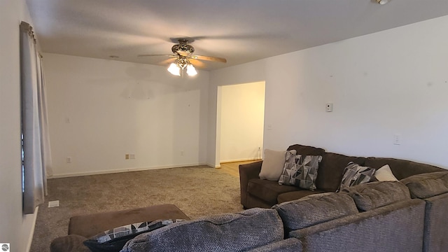 carpeted living room featuring ceiling fan