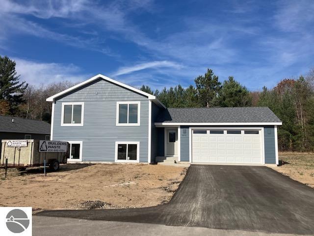 split level home featuring a garage