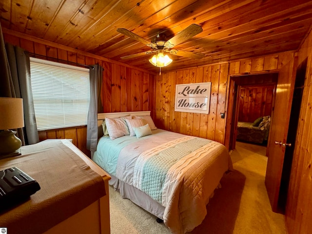 bedroom with light colored carpet, ceiling fan, and wooden ceiling