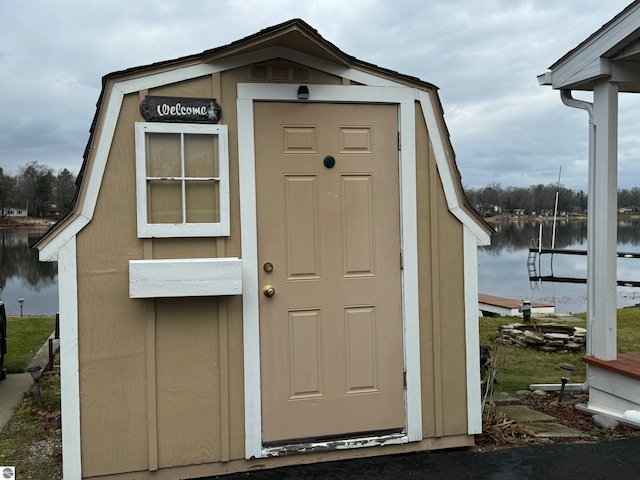 view of outbuilding featuring a water view