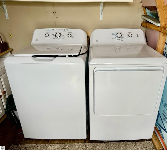 clothes washing area featuring washing machine and dryer