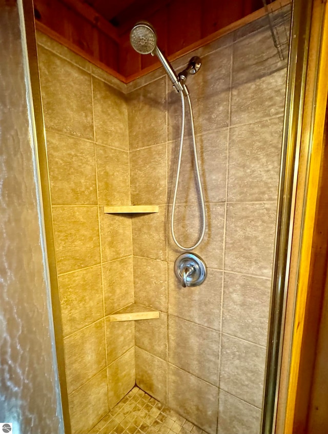 bathroom with tiled shower