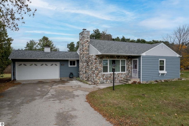 ranch-style home featuring a garage and a front lawn