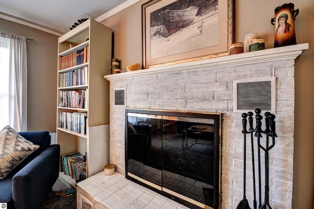 room details with a brick fireplace and ornamental molding